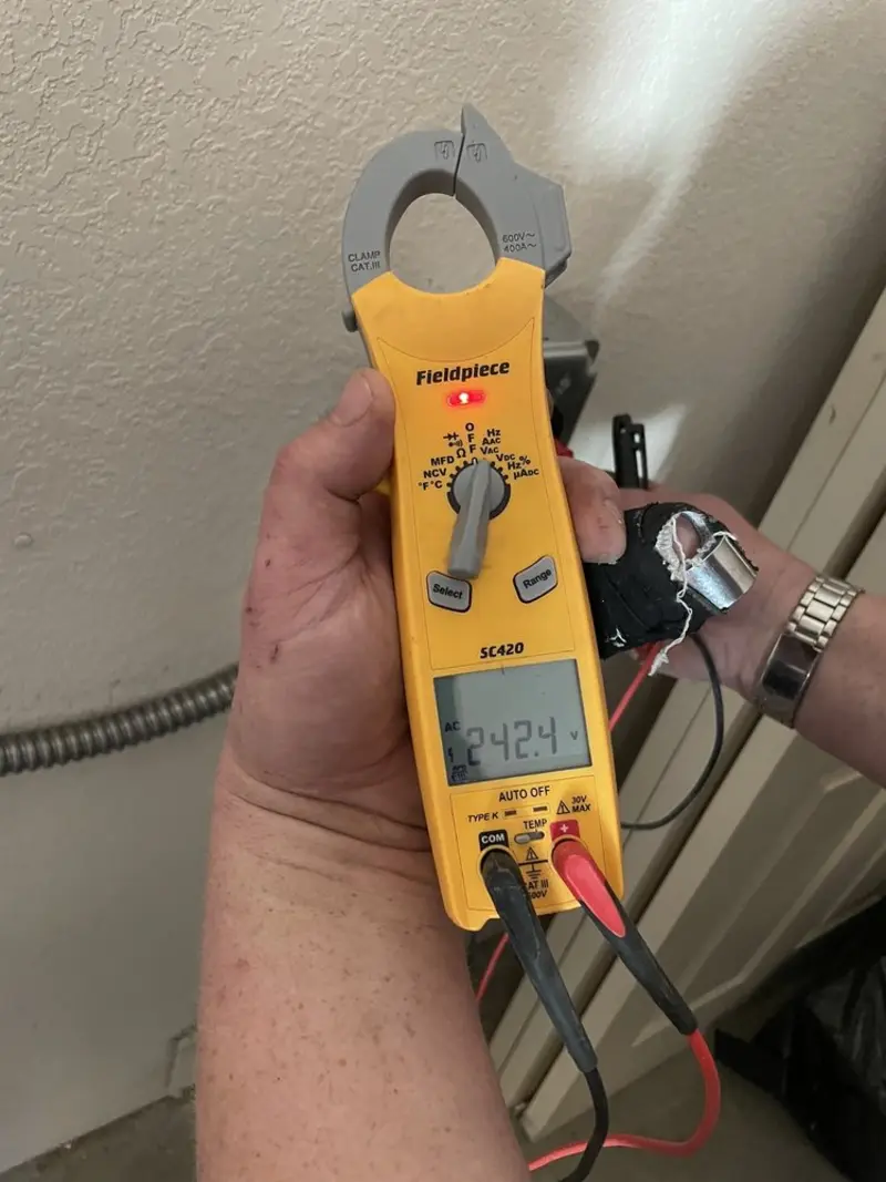 Voltage testing with clamp meter during Circuit Breaker Repair in Bigfork